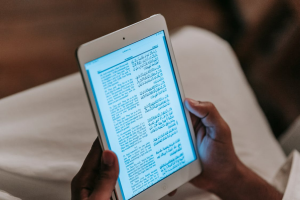 ai language | JUST KINDLE BOOKS reading a tablet in two languages